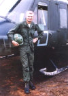 Jim Bracewell in front of his Huey at LZ Hammond