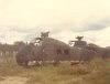 Old choppers at rest in a field in Vietnam