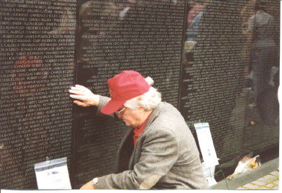 Spencer placing Tom's tribute at The Wall