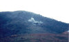 B Battery, 7th Bn, 15th FA shooting direct fire from 8 Inch Hill at a VC Cave on the side of Miss America Mountain, October 1967